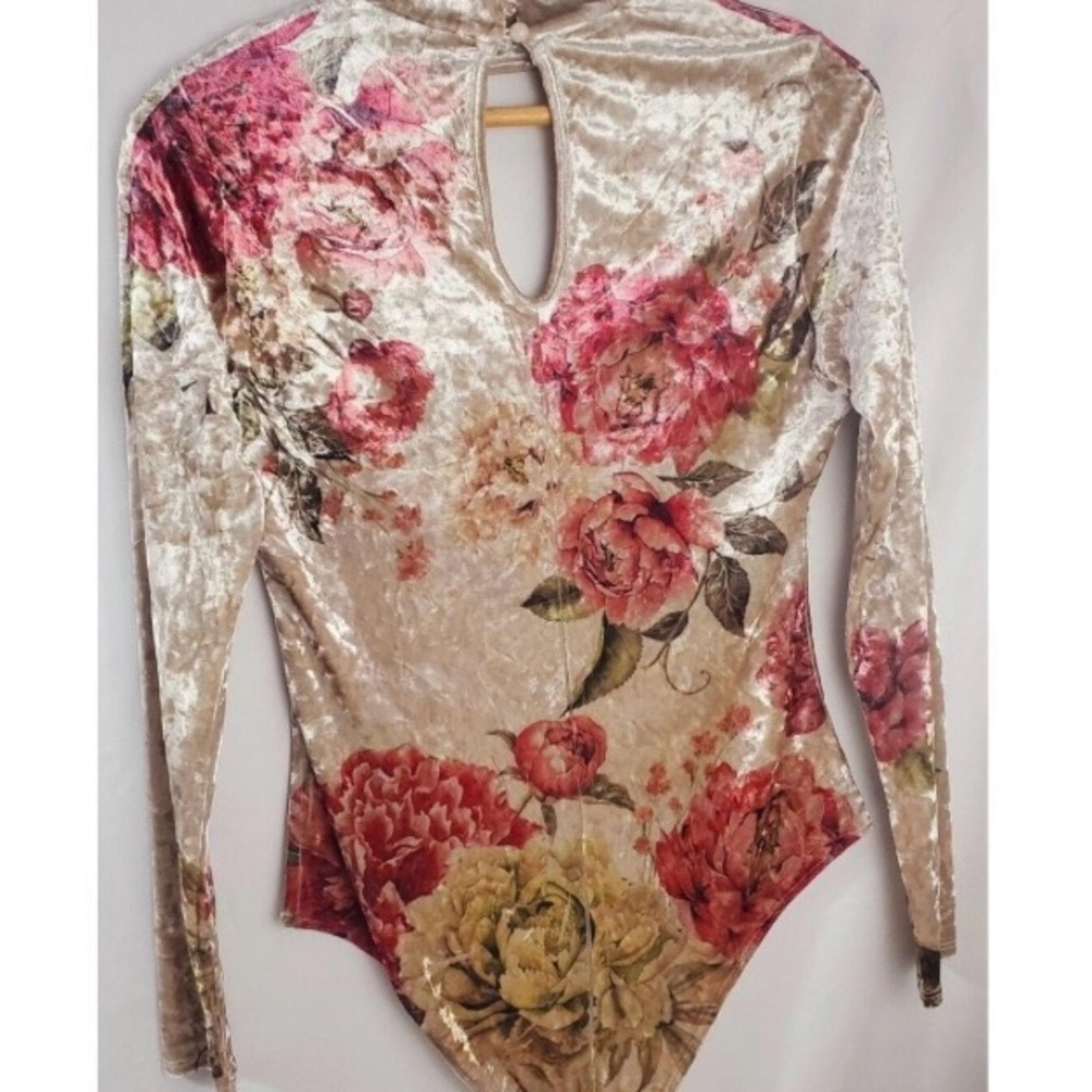 Cream long sleeve plunge bodysuit with cut out